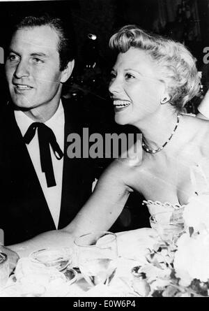 Singer Dinah Shore at a dinner with husband George Montgomery Stock Photo