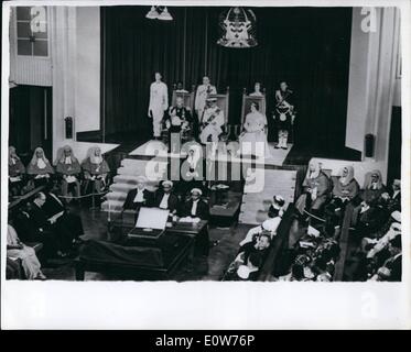 Dec. 12, 1961 - Tanganyika gets independence. Duke reads the throne speech. Great celebrations were held throughout Tanganyika territory to mark the granting of Independence during the weekend. The constitution was formally handed over by Prince Philip during a ceremony in the capital Dar-Es-Salaam. This marks the end of 42 years of British rule. Keystone Photo Shows: The scene as the Duke of Edinburgh reads the Queen's Speech from the throne in the Karimjee Hall, Dar-es-Salaam. He is seated between Gov. Gen. Sir Richard and Lady Turnbull. JSS/Keystone Stock Photo