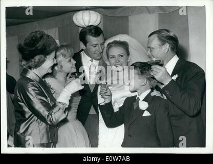 Oct. 10, 1961 - Juliet Mills Marries Actor Juliet Mills, 19, married American actor Russell Alquist, 25, at St. Mary Magdalene Church, Cowden, Kent. Photo Shows: The Mills family toasting the couple at the reception: left to right - Mary Hayley Bell Mills, Hayley Mills, the groom, the bride, Jonathan Mills and John Mills. Stock Photo