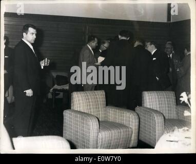 Jan. 01, 1962 - Fighter under Marciano's management to meet Henry Cooper Tomorrow Night: Tony Hughes, 23, of Cleveland, who is managed by former world champion Rocky Marciano, will meet British and Empire heavyweight champion Henry Cooper tomorrow night at Olympia in London. Photo Shows Tony Hughes takes a back seat to Marciano at a Press Conference at the Cumberland Hotel today. Hughes (at extreme left) is quite alone as reporters gathers round his manager to interview him. Stock Photo