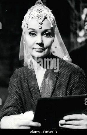 Jan. 06, 1962 - Ludmilla Tcherina, who has been filming ''Les Amants de Teruel'' under the direction of Raymond Rouleau for 5 months, had a heart attack while filming one of the last scenes of the movie. Today, after taking an 8 day break which the doctors prescribed for her, Tcherina returned to the studio. Tcherina is pictured here holding a mirror in a scene from the movie entitled ''The Marriage Preparations' Stock Photo