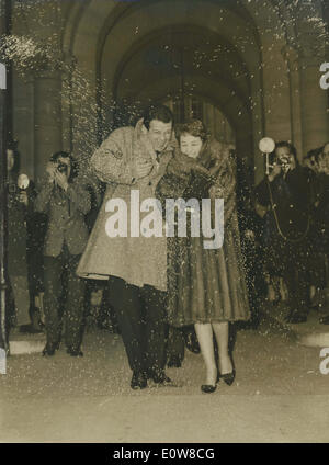 Jan 06, 1962 - Rome, Italy - RENATO SALVATORI and his new bride ANNIE GIRARDOT leave town hall while white rice are thrown in the air. Stock Photo
