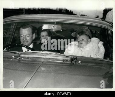 Nov. 11, 1961 - Heir Of Marquess Of Milford Haven Baptised This Afternoon: The Earl of Medina, four-month-old heir of the Marquess and Marchioness of Milford Haven, was baptised ''George Ivar Louis Mountbatten'' this afternoon at St. Andrew's Presbyterian church Hampstead, London. Photo Shows: The Marquess seated in his car the Earl Of Medina being held up by his nurse; and the Marchioness in the back of the car, as they left after the christening today. Stock Photo