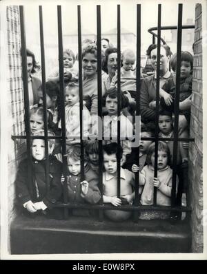 Nov. 21, 1961 - Gaitskell visit centres for homeless in London. Photo shows mothers and children at the Morning Lane Centre in London press close to the railings during Mr. Gaitskell's visit this morning. Stock Photo
