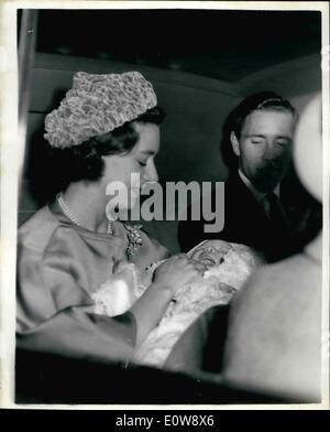 Dec. 12, 1961 - Viscount Linley Christened today; Viscount Linley, the 6 1/2 week old son of Princess Margaret and the Earl of Snowdon, was christened today at Buckingham Palace. Photo Shows Princess Margaret, holding Viscount Linley, leaving Buckingham Palace by car after the christening this afternoon. Stock Photo