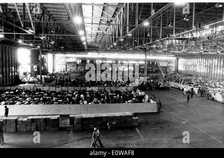 Cuban Refugees stay in aircraft hangar Stock Photo