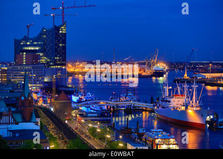 Elbe River with the museum ship Cap San Diego and Elbe Philharmonic Hall, at dusk, Hamburg, Germany Stock Photo