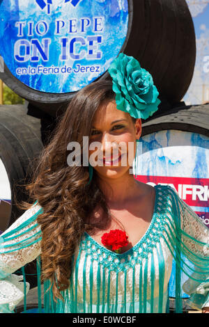 Young woman wearing a gypsy dress at the Feria del Caballo, Jerez de la Frontera, Cádiz province, Andalusia, Spain Stock Photo