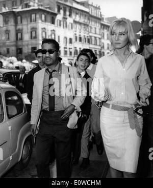 Sammy Davis Jr. walking the streets of Rome with his wife May Britt Stock Photo