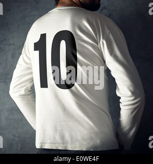 Man wearing sport shirt with number ten printed on his back. Stock Photo