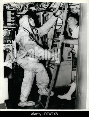 Oct. 10, 1962 - Navy men escape from Submarine in experiment: Royal Navy men escapes from the submarine Tiptoe lying 260ft. down on the Mediterranean seabed and made history for the Navy: no R.N man has ever survived an ascent to the surface from more than 150 feet before. The team experimenting with new escape methods is from the submarine escape training school near Gosport, Hants.Photo shows Petty Officer Leonard Stokes about to enter the escape tower of Tiptoe. Stock Photo