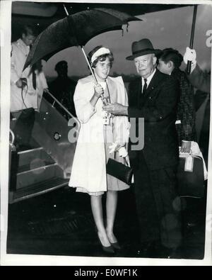 Aug. 08, 1962 - Ike in London General Eisenhower flew into Northolt: Airport this evening on his visit to Britain. He hopes to visit his old friend Sir Winston Churchill and has been invited to lunch with the Queen at Buckingham Place tomorrow. He hopes to play gold during his stay. Photo shows Sheltering under an umbrella soon after his arrival is General Eisenhower and his 13-year-old grandaughter, Barbara Ann. Stock Photo