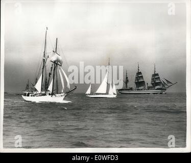 Aug. 12, 1962 - Race to Rotterdam starts: Thirty two vessels began the Torbay to Rotterdam Tall Ships race at 3pm yesterday when the Duke of Edinburgh fired the starter cannon from the deck of the Royal Yacht Britannia. The race had been delayed for three hours due to bad weather, and is due to end by Thursday. Photo shows L'Etoil the French entry a 227 ton top sail schooner seen on left, centre is a small Yacht unindentified and the Italian full rigged ship Americgo Vespucci seen at the start of the race. Stock Photo