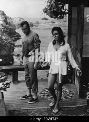 Aug. 30, 1965 - Hollywood, CA, U.S. - Two time Academy Award winning screen legend ELIZABETH TAYLOR, known for her glamorous Hollywood lifestyle and numerous husbands died March 23, 2011 of heart failure. PICTURED: Liz Taylor and husband RICHARD BURTON in a 'beatnik' look after the premiere of, 'The Sandpipers.' Stock Photo