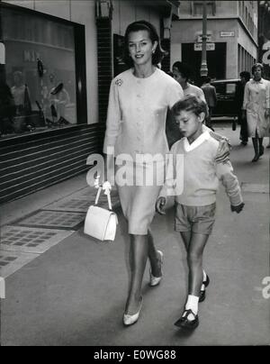 Sep. 09, 1962 - Dawn Addams and son in London: A charge of abduction was lodged against British actress Dawn Addams by her husband, Prince Vittorio Massimo, in Milan yesterday. Prince Massimo, who is separated from Miss Addams, has custody of their seven year-old son Stefano except for one month a year. Miss Addams took her son for a holiday and he was due to be returned to his father at midnight on Monday. But his mother had arrived in England and took action to make him a temporary ward of the High Court. He cannot be taken out of Britain without the Court's permission Stock Photo
