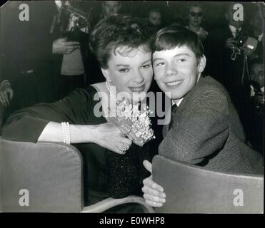 May 05, 1963 - Judy Garland Gives a Press Reception at the Savoy Hotel for her Latest Film ''I Could Go on Singing''. Judy Garland who is over here for the World Premiere of her latest film ''I Could Go on Singing'' at the Plaza Theatre on Wednesday, gave a party to the press in which they meet Gregory Phillipllips a young star who plays her son in the film. Photo Shows: Judy Garland is seen with Gregory Phillips, her son in the film at the party at the Savoy Hotel this evening. Stock Photo