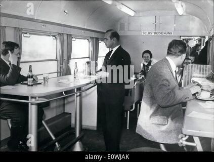 Mar. 03, 1963 - Rolling snackbars on german railways: Due to shortage of personnel, the German Dining and Sleeping Car Company has developed a new kind of dining car the rolling snackbar with self-service. The so called 'bufett-wagons'' look like a snack bar, with the passengers buying their drinks or their food at the bufett line with possibility to use tables and chairs. Some 50 of these wagons will be in service on express-tarins until summer. Only two people, a cook and a keeper, are running the self-service bufett wagon. Stock Photo