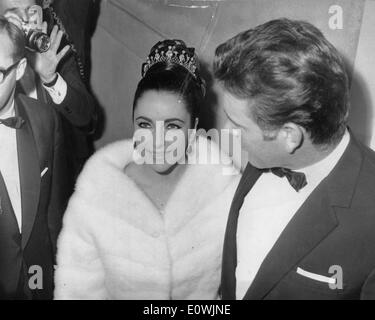 Mar. 16, 1963 - Paris, France - Two time Academy Award winning screen legend ELIZABETH TAYLOR, known for her glamorous Hollywood lifestyle and numerous husbands died March 23, 2011 of heart failure. PICTURED: Liz Taylor at the premiere of 'Lawrence of Arabia' with fifth husband RICHARD BURTON, at the Champs Elysees Theatre. Stock Photo