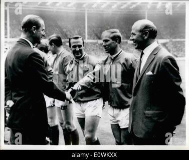 May 05, 1963 - Manchester United beats Leicester city 3-1 in cup final: Prince Philip shakes hands with Bobby Charlton, Manchester United's outside left (He scored one of the his team's goal this afternoon) before today's F.A. Cup Final at Wembley. Seen at right is Matt Busby, United's manager. Stock Photo