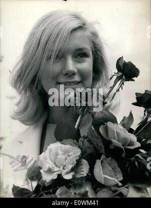 Jul. 17, 1963 - The American actress Yvette Mimieux arrived at Orly for a short vacation in Paris. She is wrapping up filming for Georges Pal's ''The Wonderful World of the Brothers Grimm,'' in which she is the female star. Here she is at her arrival at Orly Airport with a bouquet of roses. Stock Photo