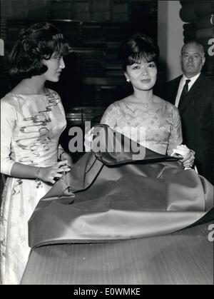 Sep. 09, 1963 - Rome 23.9.63 = Madame Ngo Dinh Nhu of South Vietnam during a visit in Rome, shopping in the silk shop. M.lle Nhu, has counseled her mother to the purchase. Stock Photo