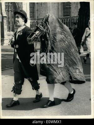 Sep. 09, 1963 - ''Hop Hoodening'' in Canterbury: The traditional ''Hop Hoodening'' to celebrate the harvest in Kent was held today at Canterbury. Photo shows John Mathias, of Dymehurch ''a fool' leads the Hooden Horse (David Sheasby, of Dover) during the traditional celebration in Canterbury today. Stock Photo