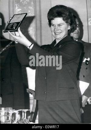 Feb. 02, 1964 - Medal For Spacegirl Val: The World's first woman in space, Valentina Tereshkova, who is in England on a week's visit as the guest of the British Interplanetary Society, tonight attended their reception at the Piccadilly Hotel, at which they presented her with a special gold medal in recognition of her achievement. Photo shows After the presentation, Valentina Tereshkova hold her medal aloft to the assembly of members of the British Interplanetary Society. Stock Photo