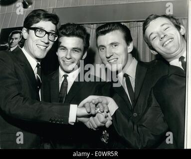 Nov. 11, 1963 - New shadow meets the group: 21 year old John Rostill has joined the famous ''Shadows'' instrumental group as the bass guitarist in place in Brian ''Liquorice'' locking who has left to devote more time to his religion. John Rostill is a former pupil of Rutlish School. Photo shows John rostill (2nd from left) meets the other Shadows (left to right) Hank B. Marvin, Bruce Welch and Brian Bennett. Stock Photo