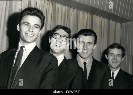 Nov. 11, 1963 - New Shadow meets the Group: 21 year old John Rostill has joined the famous ''Shadows'' instrumental group as bass guitarist in place of Brian ''Liquorice'' Locking who has left to device more time to his religion. John Rostill is a former pupil of Rutlish School. Photo shows John Rostill (left) meets the rest of the group (left to right) Hank B. Marvin, Bruce Welch and Brian Bennett. Stock Photo