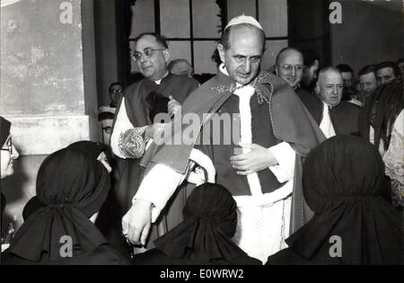 Feb. 08, 1964 - Pope Paul VI visited the High Seminary of St. John is Laterano this morning and celebrated the mass. Today is the feast of Cur Lady of Confidence. Pope Paul VI after the ceremony dwelles with the seminarist and some nuns of the seminary. Many workmen who worked in a new building of the seminary welcomed the Pope. Photo Shows Some Nuns of the Seminary Kissing the Pontiff's hand. Stock Photo