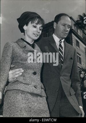 Mar. 03, 1964 - American actress Audrey Hepburn arrived this morning in Rome accompanied by her husband actor Mel Ferrer. The charming actress will be received tomorrow at Quirinale by President Segni during the audience for the ''David f Donatello'' Prize Presidency and actors who has won ''David of Donatello'' Prize one of italian most important Prizes. Photo shows Audrey Hepburn and Mel Ferrer in the Spanish steps tenderly linked and happy. Stock Photo