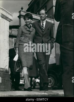 Mar. 03, 1964 - American actress Audrey Hepburn arrived this morning in Rome accompanied by her husband actor Mel Ferrer. The charming actress will be received tomorrow at Quirinal by President Segni during the audience for the ''David of Donatello'' Prize Presidency and actors who ha won ''David of Donatello'' Prize one of Italian most important Prizes. photo shows Audrey Hepburn and Mel Ferrer on the Spanish steps tenderly linked and happy. Stock Photo