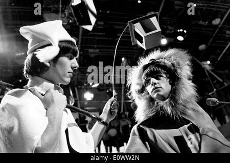 The Beatles Ringo Starr and George Harrison rehearsing for a television show Stock Photo