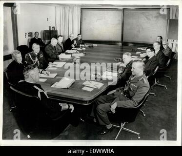 May 14, 1964 - New Defence Operations Room: The Chiefs of Staff have now moved in to the new Defence Operations Room in Whitehall, formerly occupied by the Board of Trade. Photo shows in the new Operations Room, KARL MOUNTBATTEN the left side of the table, Admiral Sir David Luce , J.H. Lapsley, Brigadier J.Gibbon, Vice Admiral Sir Norman side of the table are General Sir Richard Hull, Air Chief Marshal Sir Alfred Earle, Mr. C. Rose , foreign office, MR. J.A.Higham, Colonial Office, and Mr.C.W.Wright, Defence Secretariat. Stock Photo