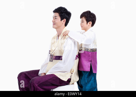 father and son wearing traditional Korean outfits Stock Photo