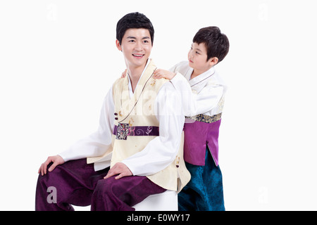 father and son wearing traditional Korean outfits Stock Photo