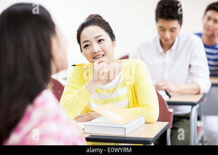 a woman studying in class Stock Photo