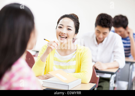 a woman studying in class Stock Photo