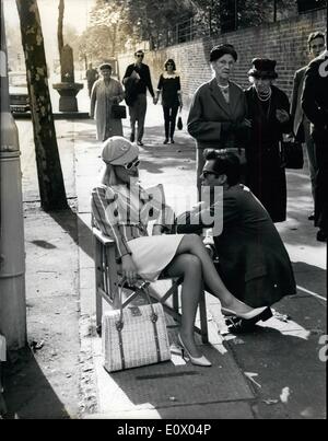 Sep. 09, 1964 - Julie Starts Work On Her First Star Part...Cricket Enthusiast At Lords... Lovely Julie Christie who has been groomed for stardom with a number of small parts in films - was to be seen starting work on her first starring role.. It is opposite Dirk Bogarde and Laurence Harvey and the film is entitled ''Darling''.. The scene was a queue for a test match outside Lords - in which she queues with 200 extras for the match... Keystone Photo Shows:- Julie Christie - wearing a pink cricketing cap and striped cricket blazer - talks with Dirk Bogarde - between filming outside Lords. Stock Photo