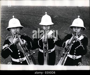 Nov. 11, 1964 - Bandmaster Albert Hall and his ''Sweet music'' introducing the musical rifle; After months of practice three members of the Royal Marine Band have perfected their playing of the ''Musical Rifle'' - under the guidance of Bandmaster Albert Hall The instrument sounds rather like a Post horn - and their specialty is ''The Post Horn Gallop'' They will be playing it on Friday when Earl Mountbatten visits the Naval Air Command Headquarters in a Ceremony to mark 50 years of naval flying and the 25th, anniversary of the Fleet Air am Stock Photo