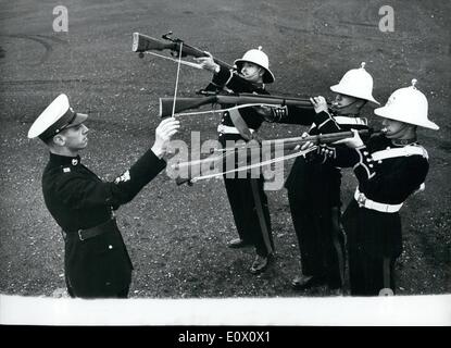 Nov. 11, 1964 - Bandmaster Albert Hall And His 'Sweet Music''.. Introducing The Musical Rifle. After months of practice three members of the Royal Marine Band have perfected their playing of the ''Musical Rifle'' - under the guidance of Bandmaster Albert Hall.. The instrument sounds rather like a Post Horn - and playing it on Friday when Earl Mountbatten visits the Naval Air Command headquarters at Lee-on-Solent - for a ceremony to mark the 50th. year of naval flying and the 25th. anniversary of the Fleet Air Arm.. Stock Photo