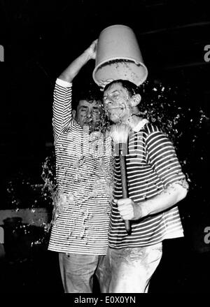 Maurice Baquet dumps water on Max Bill's head at a gala Stock Photo