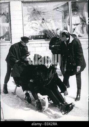 Mar. 03, 1965 - The Beatles in the Alps: On Sunday March 14th, the Beatles arrived in Obertauern/Austria in order to take some of the ourside pictures to their second film. photo shows The beatles infront of an shop with sport-articles, pawn-skiers and pawn-sledges. They test the different kind of sledges, children seldges, bob-sledges a.s.o