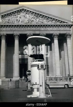 Feb. 02, 1965 - Madeleine Church New Look The traffic policeman in his newly installed white stand with a ''Roof'' protection on top confers a new look to the famous Madeleine Church situated at the bottom of Rue Royale and facing the place De La Concorde at the other end. Stock Photo