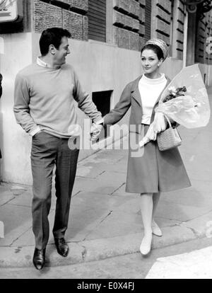 Actor Tony Curtis and his wife Christine Kaufmann taking a walk in Rome Stock Photo