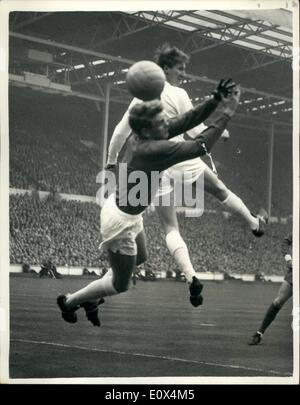 May 05, 1965 - F.A. Cup final at Wembley. Leeds United v. Liverpool. Photo shows Jackie Charlton, the Leeds centre-half, heads the ball for a corner over the head of his goalkeeper G. Sprake, during the Cup Final at Wembley Stadium today. Stock Photo