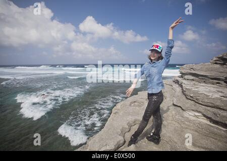(140520) -- BEIJING, May 20, 2014 (Xinhua) -- Sun Xiaoqian, a 24-year-old ballerina of the National Ballet of China, poses at seaside during their tour on Yongxing Island of Sansha, south China's Hainan Province, Jan. 11, 2014. Before being able to present perfect performance in the spotlight, every member of the National Ballet of China has to undergo severe arduous training for years. Yet they chose to persevere in what they truely love. Years of toiling not only allows them good body shape, expertise and disposition, but also offers them a life-long goal that deserves pursuing. The glory on Stock Photo
