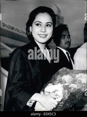 Jun. 06, 1965 - President Sukarno's new wife visits London: Ratna Sari Dewi, 24, the beautiful Japanese wife of Dr. Sukarno, the Indonesian President, arrived by air to London airport yesterday on her first visit to London. Madame Sukarno, one of the President's three wives as a Moslem he is allowed four is here to attend the delayed wedding party of her friend, the new Viscountess Newry, who married the Earl of Kilmorev's heir in Hamburg this month. Photo shows Madame Sukarno pictured on her arrival at London Airport yesterday. Stock Photo