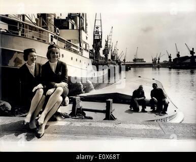 Jul. 01, 1965 - Dock hostesses for showing tourists around: London docks with 2,868 acres of land, 666 acres of water and 35 miles of quayside, has got two more attractive statistics yesterday. They were the first of a group of ''personality girls'' hired to tell visitors all about the docks. More than 400 girls applied for the jobs, But, to begin with, only two were chosen. Photo shows the ''Personality Girls''j 24-year-old Diane Sheldon, at the docks yesterday. Stock Photo