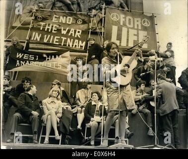 May 05, 1965 - Peace In Vietnam Meeting In Trafalgar Square: The American folk singer and freedom marcher Joan Bafz, lead a march to stop the War in Vietnam The March is Organised jointly by the Campaign for Nuclear Disbarment and committee of 100. They marched from Marble Arch to Trafalgar Sq. to hold the Rally, after which they will go to Downing St to give message to the Prime Minister Mr. Wilson. Photo Shows Joan Baez the American Folk Singer playing to the mass Rally in Trafalgar Sq this afternoon. Stock Photo